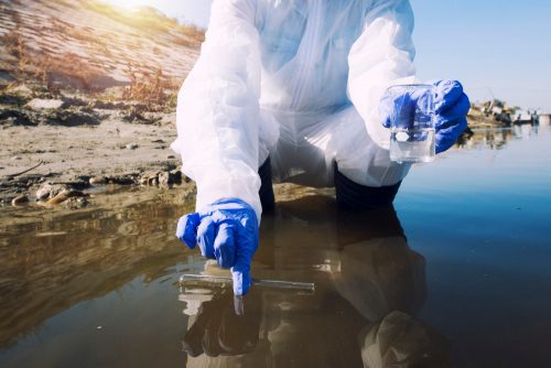 ecologist taking samples water with test tube from city river determine level contamination pollution scaled 1